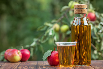 apple juice in glass and bottle