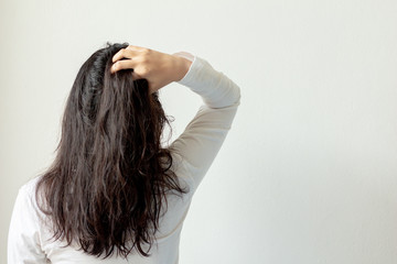 Asian woman with white t-shirt wet hair and tangled hair on white background.