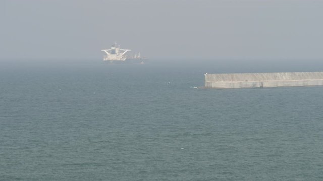 Very large tanker departs port
