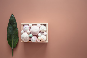 Spa composition with body care items on a colored background.