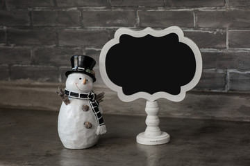 isolated holiday snowman with chalkboard