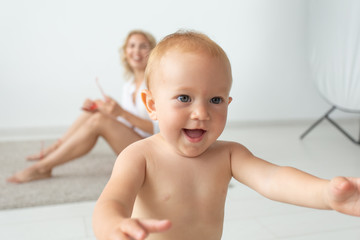 children, people, infancy and age concept - beautiful happy baby at home