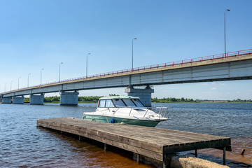 Fototapeta premium The small motorboat at the pier