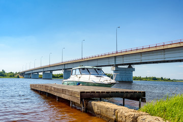 The small motorboat at pier