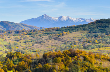 Autumn landscape, when winter slowly descends from the mountain