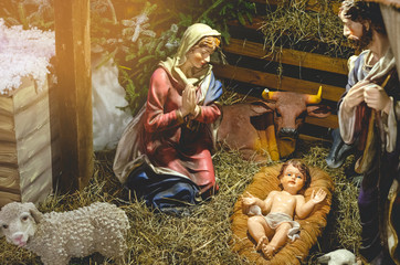 Christmas nativity scene represented with porcelain figures of Mary, Joseph and baby Jesus....