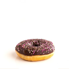 Close up of donut with sprinkle on white isolated background. Copy space