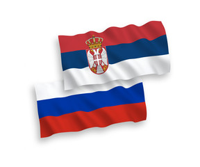 National vector fabric wave flags of Serbia and Russia isolated on white background. 1 to 2 proportion.
