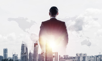 Concept of business success and control with confident boss against cityscape background