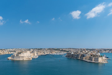Fototapeta na wymiar Valletta Malta July 27 2017 The view of the Grand Harbour (Port of Valletta) with the fortified cities of Birgu, Senglea and Cospicua. Malta.