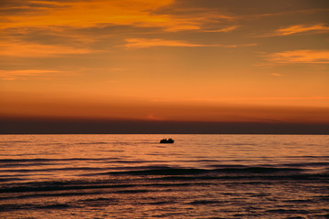 Still Baltic sea in sunset time.