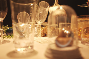 blur Many empty glasses on the table with still life pattern on a table against restaurant background.copy space