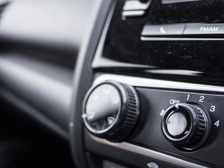 Obraz na płótnie Canvas knob on car's console (selective focus)