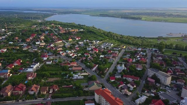 Aerial view of Slatina city and river Olt, Romania. Drone flight over the european city in summer day.