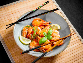 Delicious rose crevettes with chopsticks