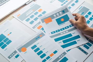 Website designer Creative planning application developer development draft sketch drawing template layout prototype framework wireframe design studio . User experience concept .