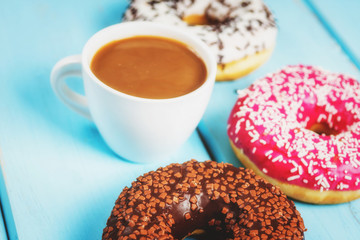 Sweet donuts on black stone table