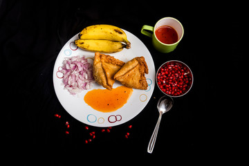 indian snack on black background