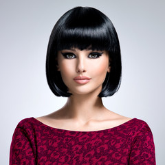 Beautiful brunette woman with bob hairstyle.