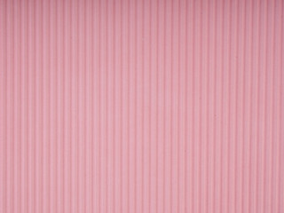 pink corrugated paper as background, copy space for text