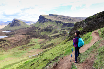 Happy girl exploring and hiking scenic mountains