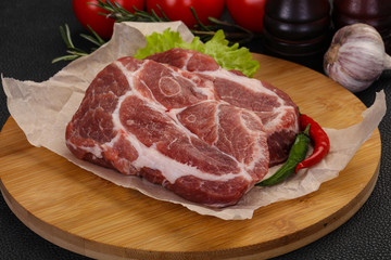 Raw pork neck steak