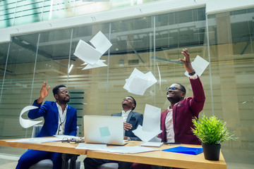 african americal stylish male working in modern big office