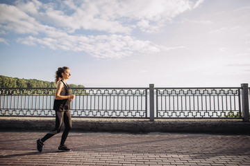 Young girl jogging in the early morning