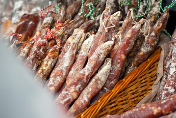 Smoked and fried sausages on the table. Meat products at the festival.