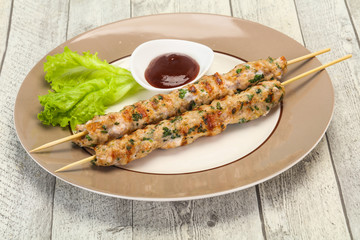 Minced pork skewer kebab with sauce