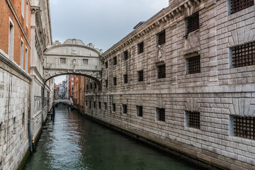 Fototapeta na wymiar Bridge of kisses on the canal in Venice