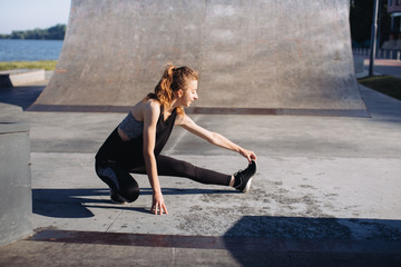 Sporty girl exercises in the morning