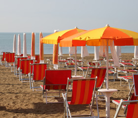sunshade and deck chairs on the beach