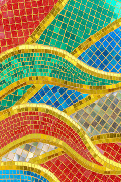 The walls are decorated with colorful  glass mosaic background texture
