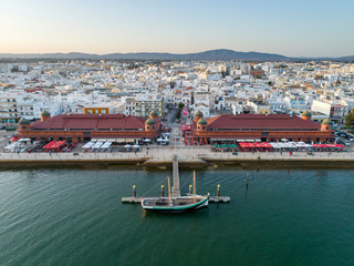 Aerial view of Olhao downtown and Market, waterfront to Ria Formosa natural park. Algarve. Portugal.