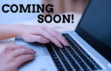 Text sign showing Coming Soon. Business photo text event or action that will happen after really short time woman laptop computer smartphone mug office supplies technological devices