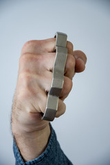 Blow brass knuckles from the bottom up, causing serious bodily harm, a threat to life and health.