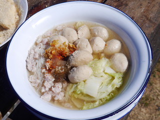 Pork ball noodles In a white zinc bowl