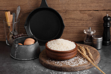 thai white jasmine rice in wooden bowl in kitchen with a blank space for a text, thai agriculture concept