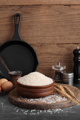 thai white jasmine rice in wooden bowl in kitchen with a blank space for a text, thai agriculture concept