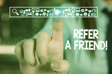 Text sign showing Refer A Friend. Business photo text direct someone to another or send him something like gift Woman wear formal work suit presenting presentation using smart device