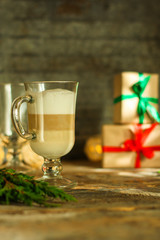 Coffee with milk and gifts on the table - festive atmosphere, (latte) New Year and Christmas. top food background. copy space
