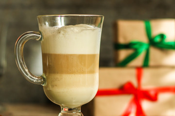 Coffee with milk and gifts on the table - festive atmosphere, (latte) New Year and Christmas. top food background. copy space