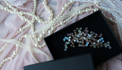Wedding background with pearls and hair accessories on pink background