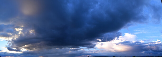 Powerful rain clouds. Horizon, moisture-bearing and vapor-forming atmospheric phenomenon, panoramic image.