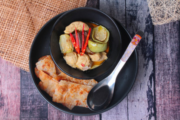Ready served of Roti , Indian food as deep fried flour ,with Thai green curry.