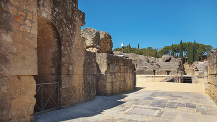 Ruins of the splendid amphitheater, part of archaeological ensemble of Italica, city with a strategic role in the Roman Empire, birthplace of Emperors Trajan and Hadrian, in Santiponce, Seville, Spain