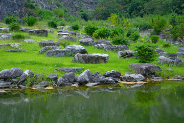 Fototapeta na wymiar Nature with riverbank and natural rocks landscape