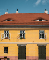 Eye-shaped windows on the roof of an old house in Sibiu city, Transylvania, Romania.
