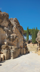 Ruins of the splendid amphitheater, part of archaeological ensemble of Italica, city with a strategic role in the Roman Empire, birthplace of Emperors Trajan and Hadrian, in Santiponce, Seville, Spain